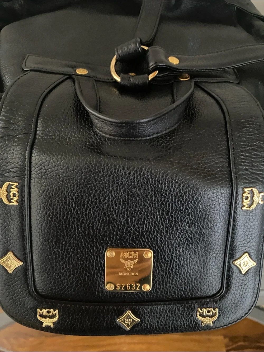 MCM Black Pebbled Leather Backpack with Gold Emblem Hardwarer